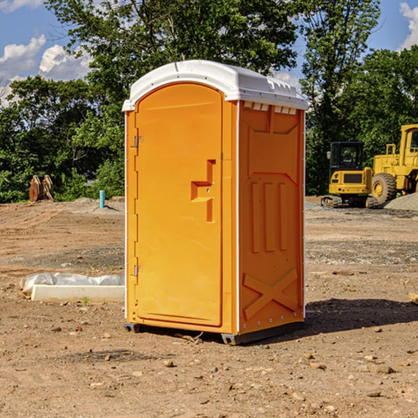 what is the cost difference between standard and deluxe portable restroom rentals in Hughes County South Dakota